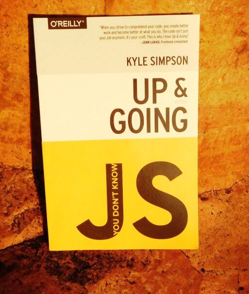 cover of book You Don't Know JavaScript: Up & Going by Kyle Simpson sitting on a rock